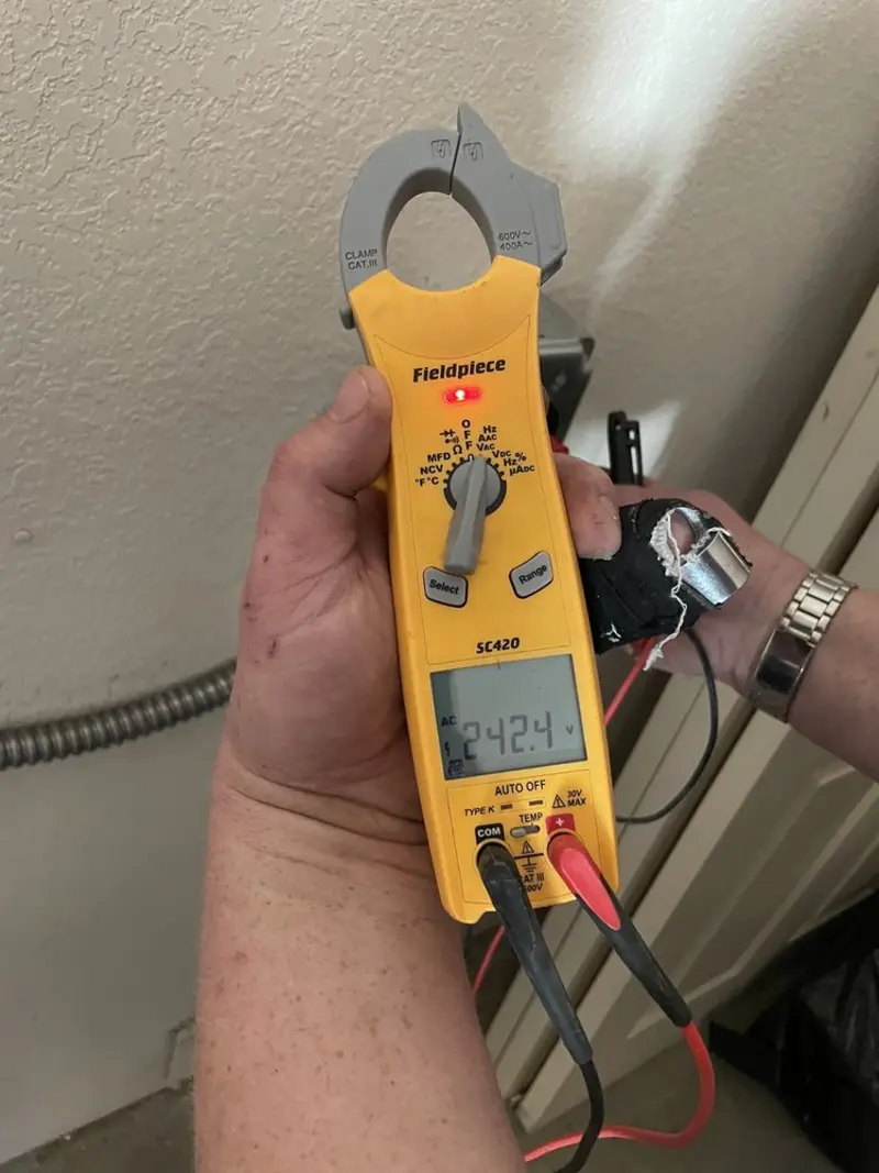 Voltage testing with clamp meter during Recessed Lighting Installation in Kennebunk